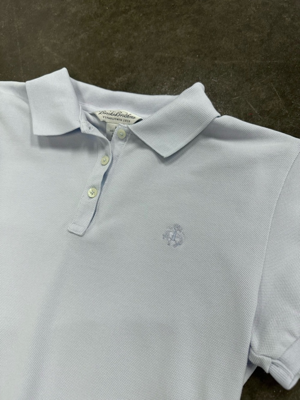 Brooks Brothers woman’s light blue polo